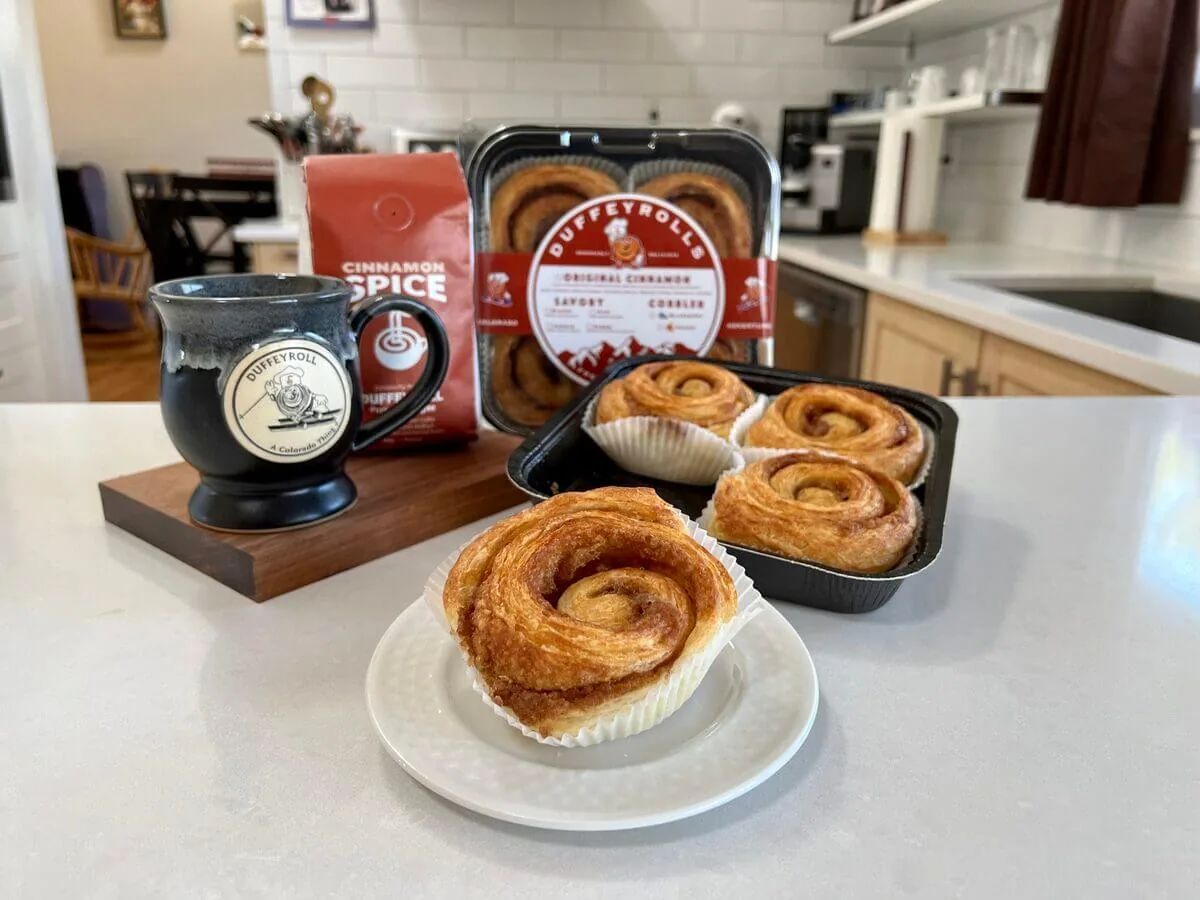 A Duffeyrolls cinnamon bake-at-home pan with a freshly baked roll.