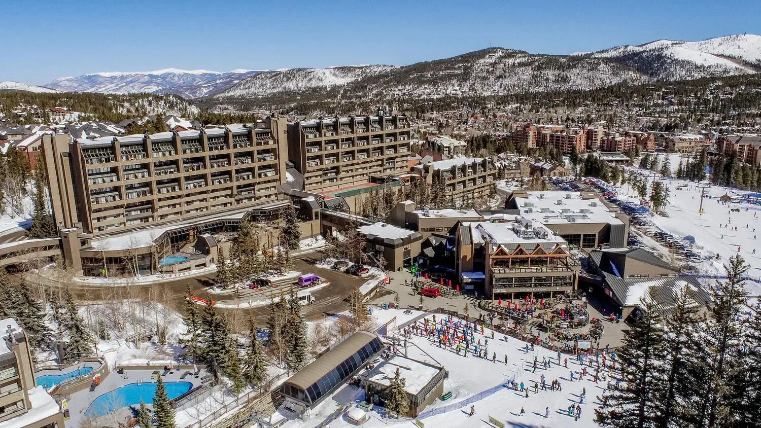 Beaver Run Resort from above in winter, with skiers at the base of Peak 8 in Breckenridge.