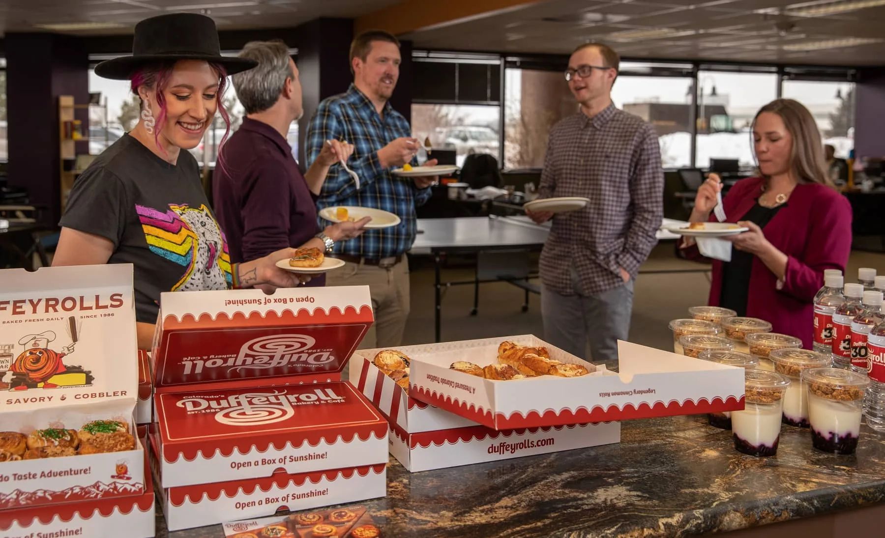 A Duffeyrolls catering spread set up for an office team.