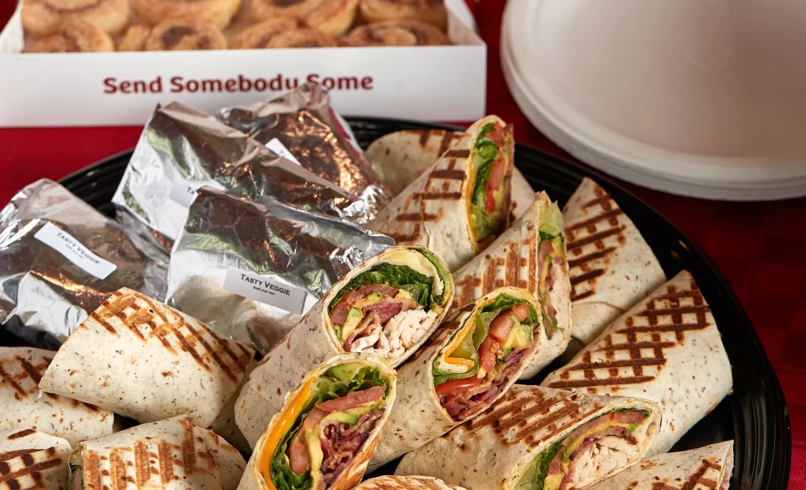 A Signature Wrap Platter beside a box of mini Duffeyrolls.
