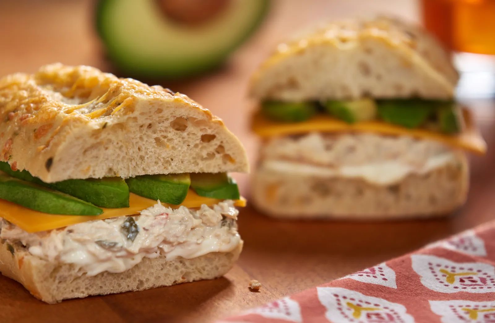 Cheddar Tunacado sandwich with avocado and cheddar.
