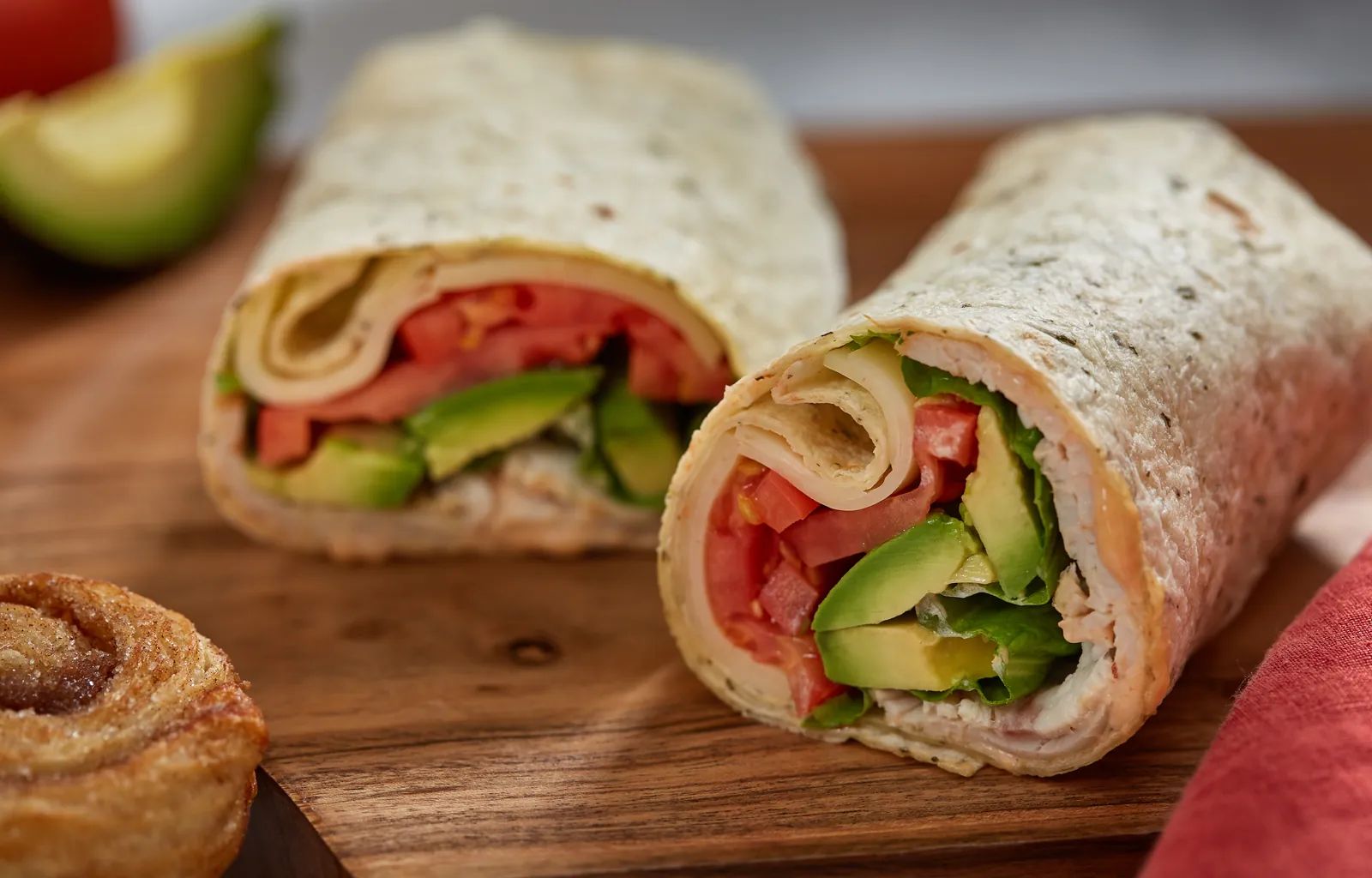 Turkey Avocado Wrap, cut in half.